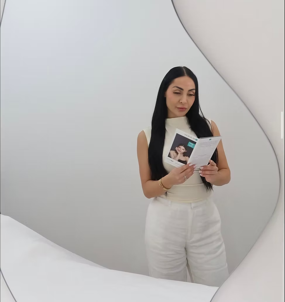 A client reading her Personalised Aesthetic Plan at CosmeticXco
